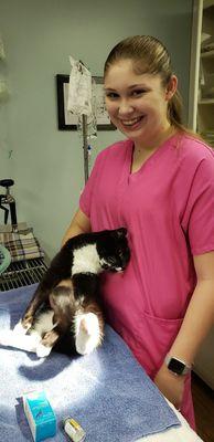 One of our interns cuddling a kitty patient.