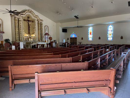 The Nave is simple, but beautiful, as are the stained glass windows representing the Stations of the Cross.