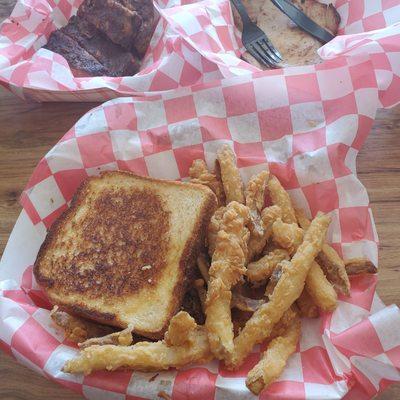 Chopped pork on Texas toast and battered fries