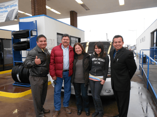 Happy family with thier new Chevrolet Suburban