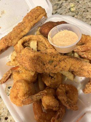 The "Soulific Platter" with Catfish, Shrimp, Crab cake, & fries. The "Soulific Sauce" is OUTSTANDING!