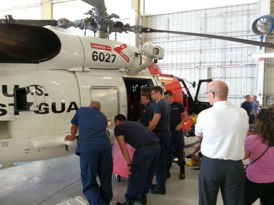 While the technicians perform routine maintenance they told us about the winch that raises the rescue basket up to the copter.