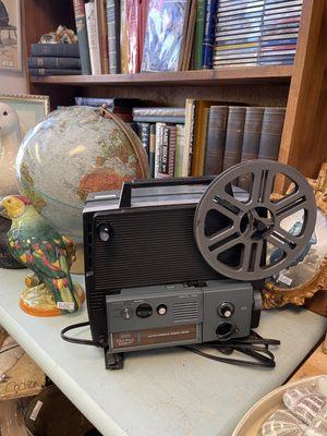 Antique and vintage books, globe, movie projector