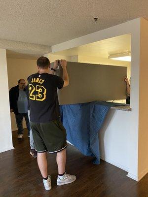 When the fridge is too big and doesn't go through the door...just move it up through the counter:)