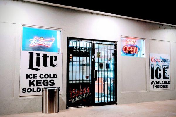 The front of the store at night.