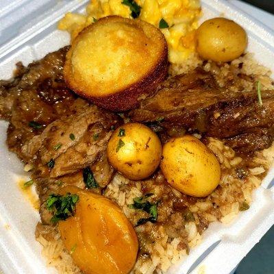 Pot roast with potatoes dirty rice and corn bread