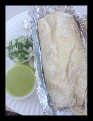 Plump bean, cheese & avocado burrito w jamaica drink $7. On the side: guaca-salsa (no heat) onion & cilantro.