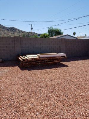 Wood fence pile to remove for Richard