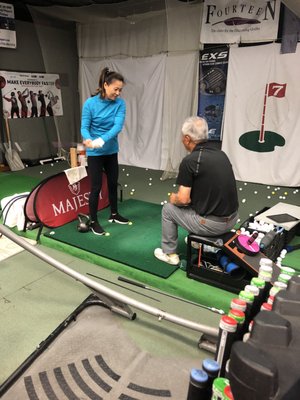 Golf lesson in the store.