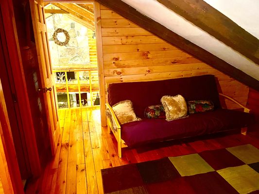 We installed a new wall separating the loft area from the main living area of this cabin. We installed the framing, paneling, door & trim