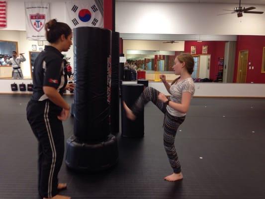 First time kicking the bag & w/ great teachers making sure she did it properly to not risk injury.