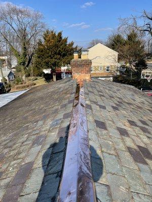 New copper ridge cap as well as new copper chimney flashing