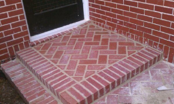 Herringbone brick, the guy had a leak in the corner. Notice we built it at a slight angle to shed the water away from the house.