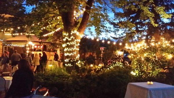 The courtyard is lit up at night for a beautiful reception or cocktail party