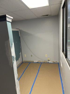 Progress shot of floors being completely covered before drywall repairs began