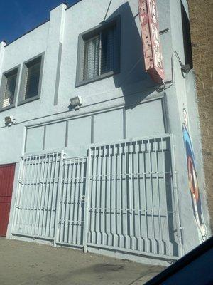 The unopened front of the liquor store, during the hours they claim they're open for.