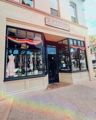 Pride flags up on the front of the shop