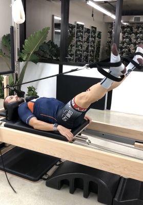 Triathlete Flavio during his private Pilates session on Reformer at Sala Pilates in Coral Gables - FL