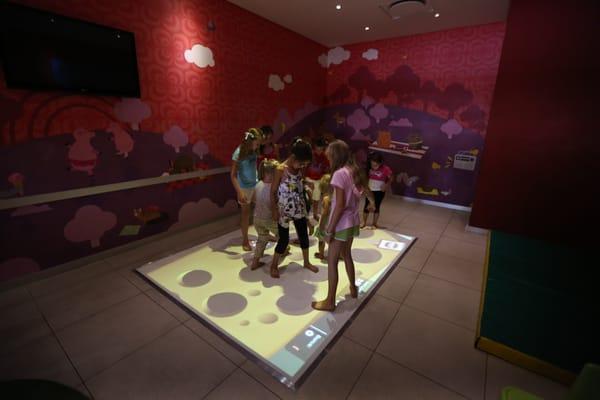 Kids playing Eyeclick at a family entertainment center