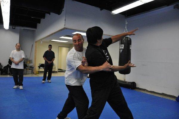 Jinbao demonstrates a bear turning the back technique