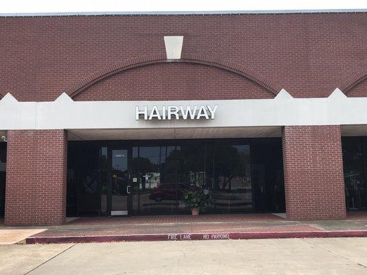 Store front of Hair Salon in the Bell Tower Shopping Center in Spring Branch.