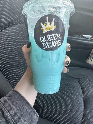 Bluzz razz lotus drink with coconut and pineapple and cream.