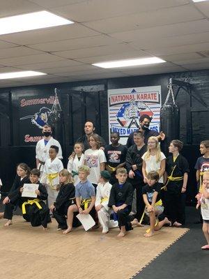 Coach Brian with his kids and the rest of the belt graduates on July 29,2020