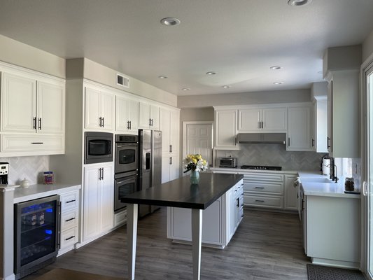 Tile Backsplash with quartz countertops and granite island