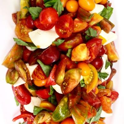 Summer Heirloom tomato, basil and fresh Mozzarella salad.