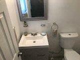 This is the bathroom it has been painted and redone with new tiles, vanity , floors, toilet etc