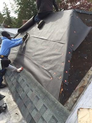 Removed existing old slate and installed new wood, new felt paper and installing new landmark shingles