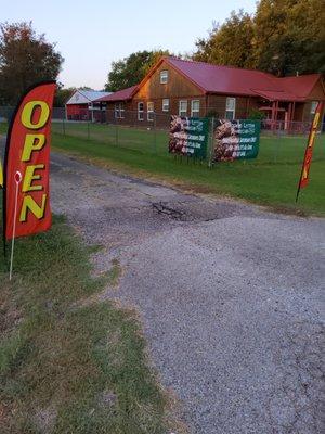 Look for the log cabin with the red metal roof. The food trailer is behind it. See you soon!