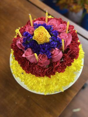 Floral birthday cake with candles