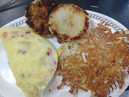 Cheese, tomato, and onion omelet. Hash browns. Grilled biscuit.