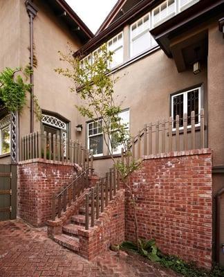 We removed a C02 leaking chimney from this home and utilized the brick for a custom staircase with milled copper railings