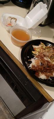 Miso soup, some "california roll" plate of teriyaki and yakisoba