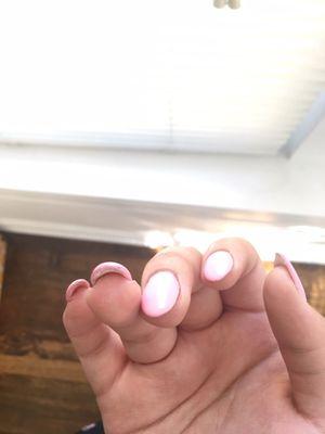 The glue is coming out through the top and the nails are thicker on one side of the nail than the other because the color is clumping.