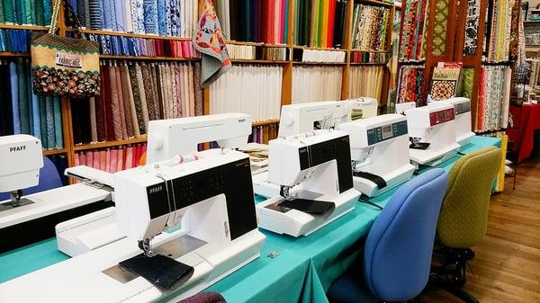 This is the row of sewing and embroidery machines you'll see when you first walk in!