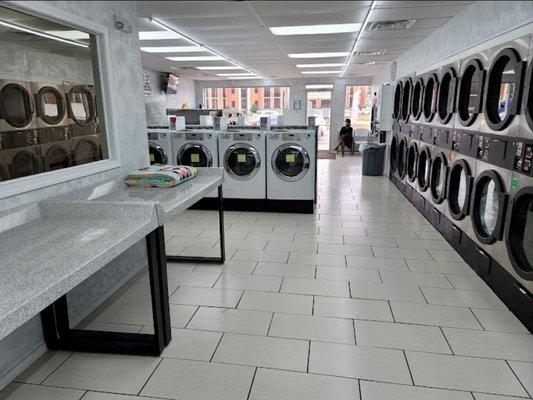 Picture of washer and dryers at laundromat.