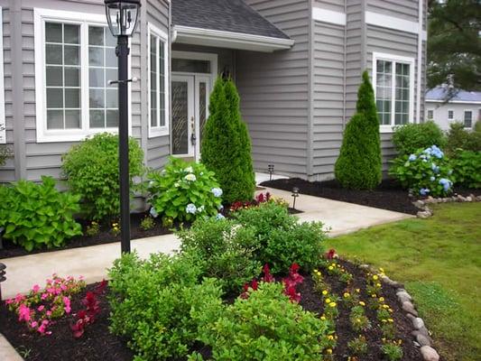 Completed concrete walk-way and bulk-planting. Spring 2014.