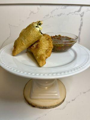 Spinach artichoke dip filled empanada