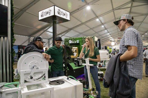 Attendees and exhibitors talk in Pavilion B at World Ag Expo® 2022.