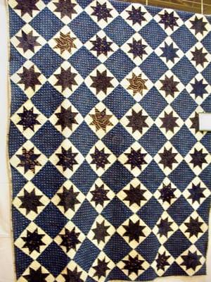 A vintage 1900 quilt top quilted and restored by Loving Quilts