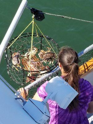 Grabbing our crabpot catch.