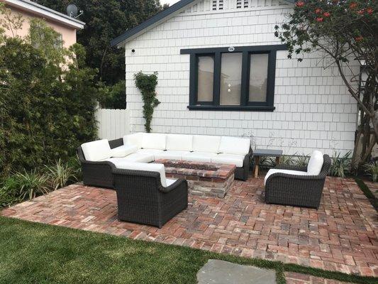 Indoor Outdoor living room and custom brick fire-pit coffee table