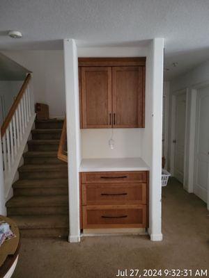 Cabinets under the stairs.