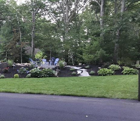 Wide view of project area, especially love the stone walkway to the patio/fire pit