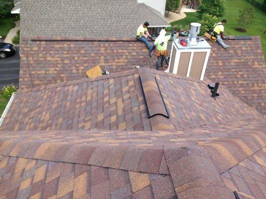 Crew installing new roof