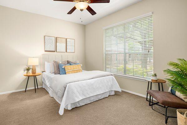 Bedroom with ceiling fan at The Lodge at Shavano Park