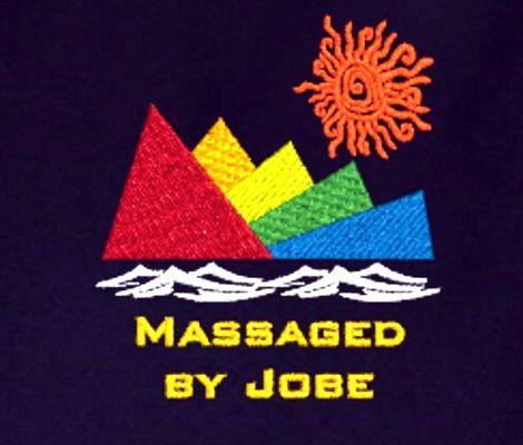 Our logo. Hawaiian petroglyphic sun, multicolored mountains white capped waves and MASSAGED BY JOBE in bright yellow lettering.